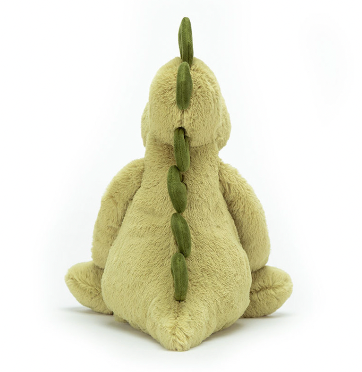 A green soft plush toy dinosaur from behind