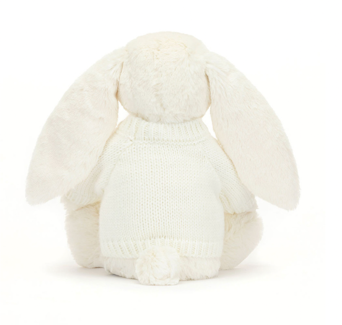 white Soft bunny toy wearing a knitted white jumper