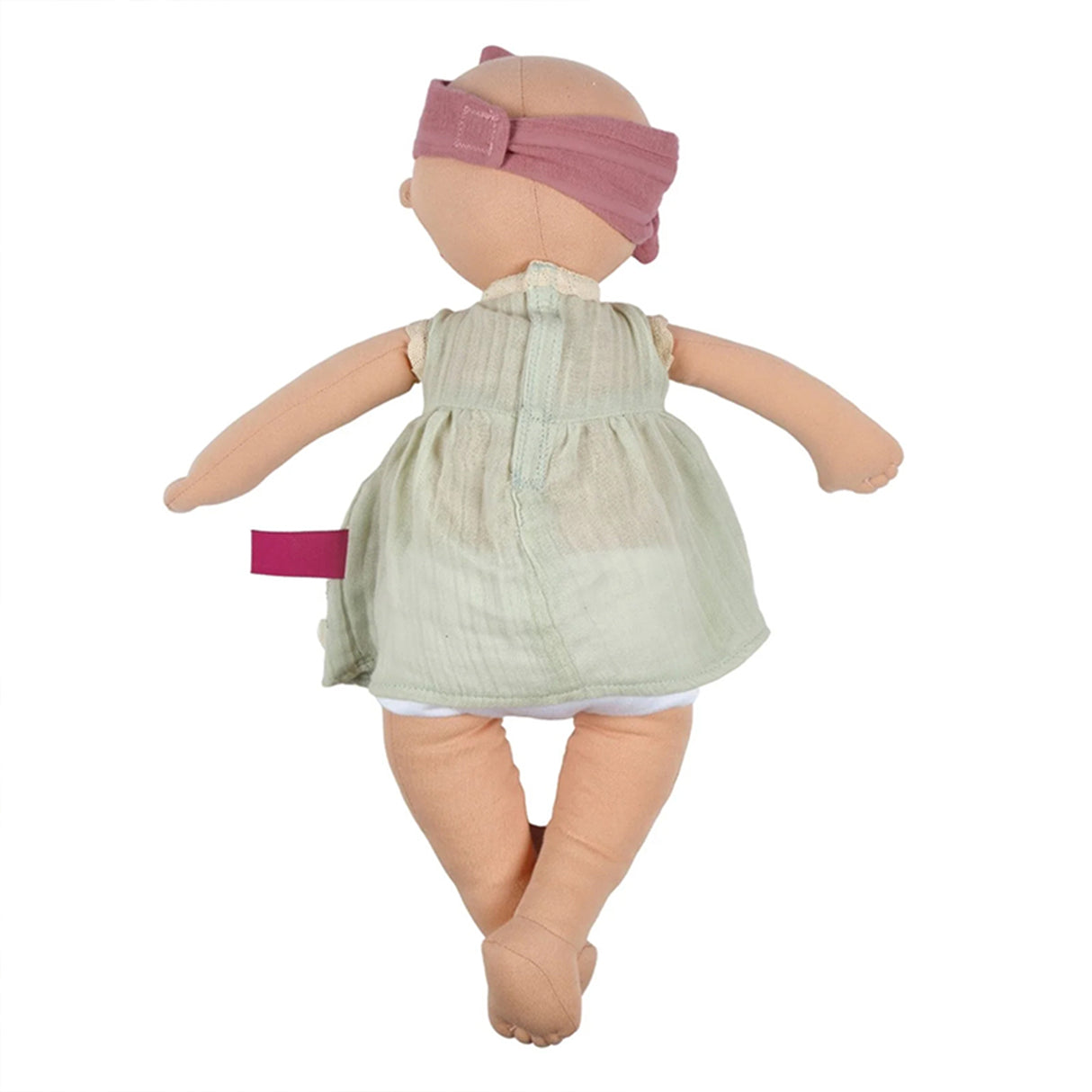 Baby doll with a green dress and pink headband on a white background