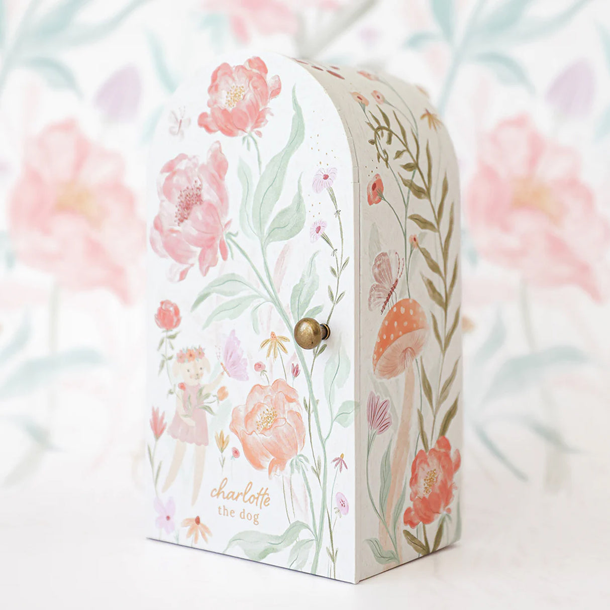Floral-themed box with 'charlotte the dog' branding on a floral background