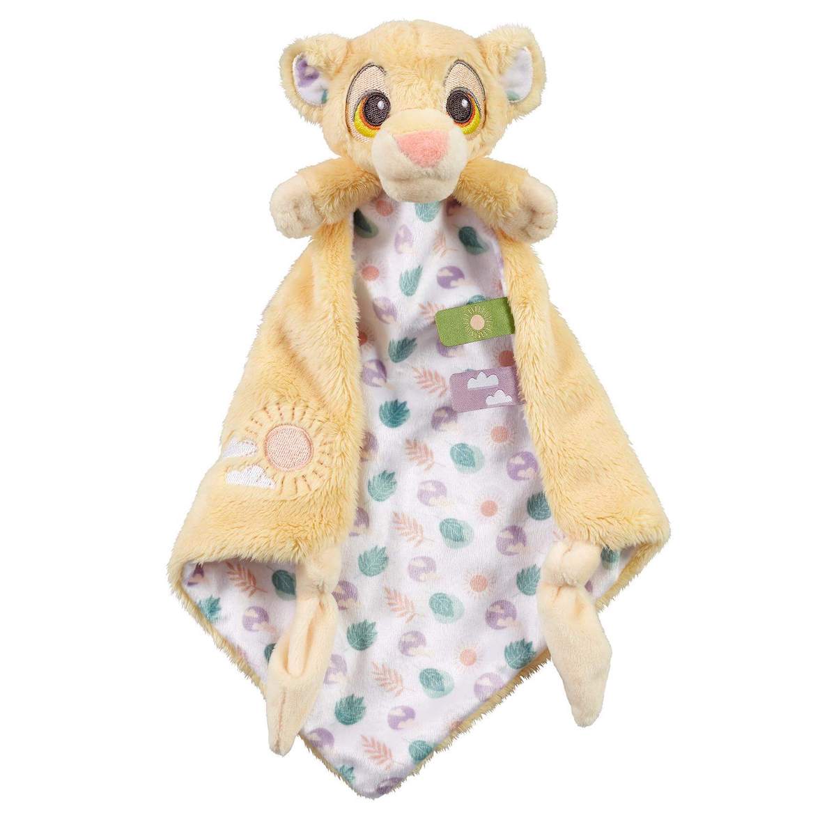 A plush baby comforter in the shape of a Simba lion cub with a gold colour scheme, featuring a nature-inspired pattern on one side and embroidered details.