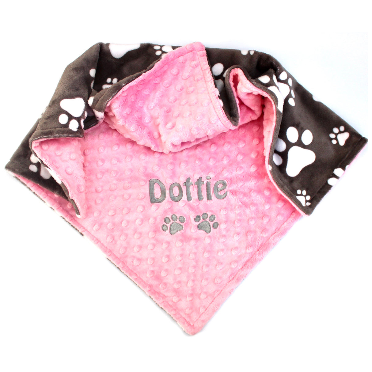 Pink pet blanket with paw print backing fabric and personalised name embroidery