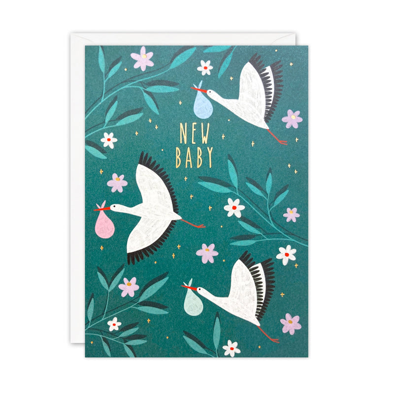 Greeting card with storks carrying baby items on a teal background
