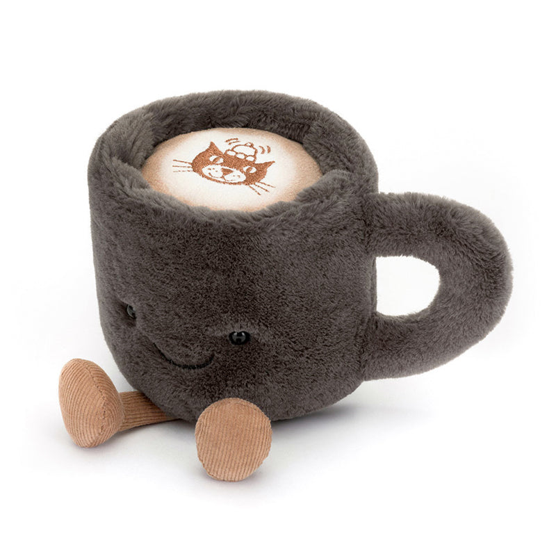 A plush coffee cup toy with a gray exterior, corduroy boots, and a smiling face.