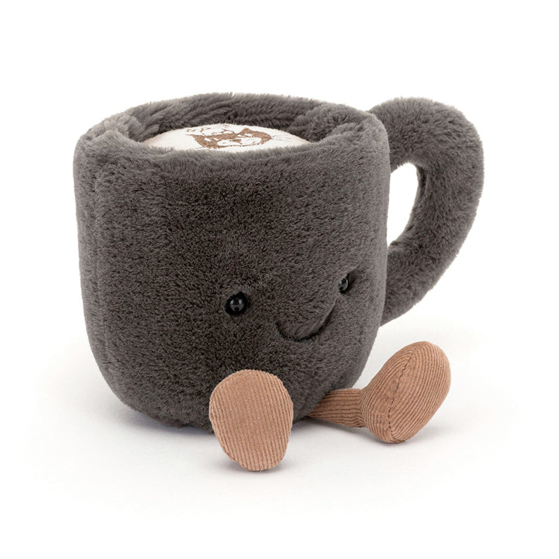 A plush coffee cup toy with a gray exterior, corduroy boots, and a smiling face.