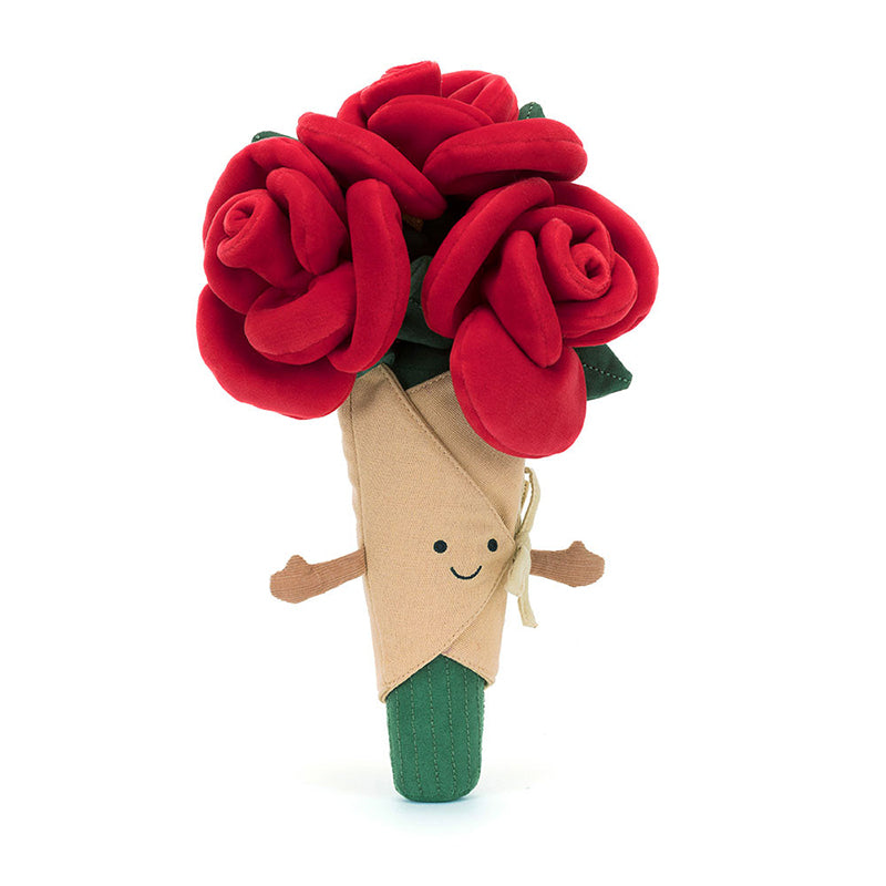 A plush toy bouquet of roses with soft red petals, green leaves, and stems, wrapped in beige linen with a smiling face embroidered on the front.
