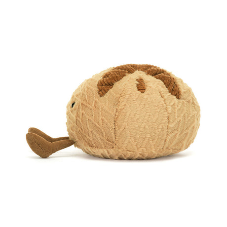 Sourdough Plush toy shaped like a loaf of bread with a smiling face on a white background