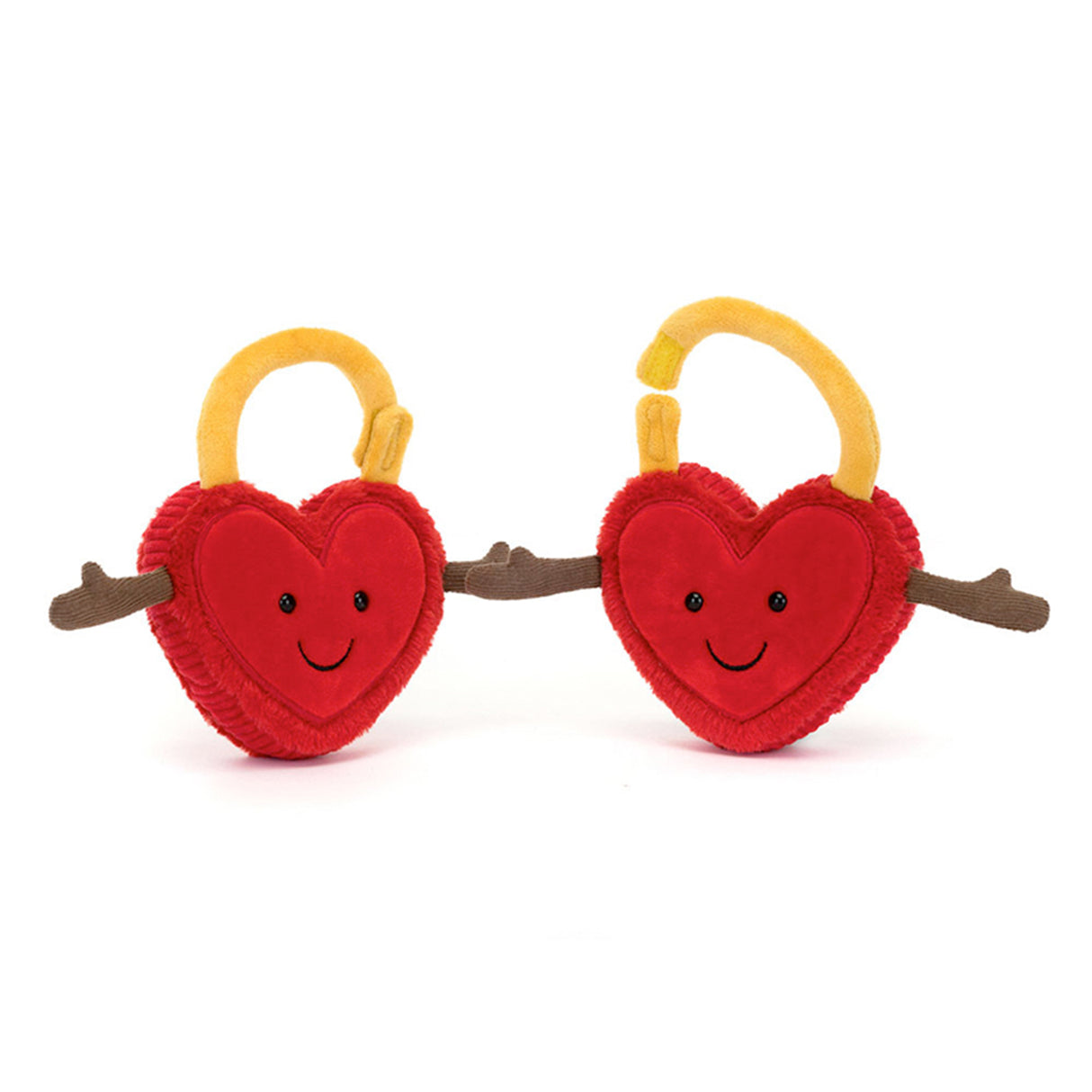 Two red heart-shaped toys with yellow handles and smiling faces on a white background