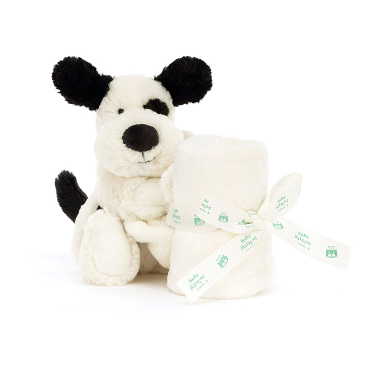 Black and white plush dog toy with a white bag on a white background
