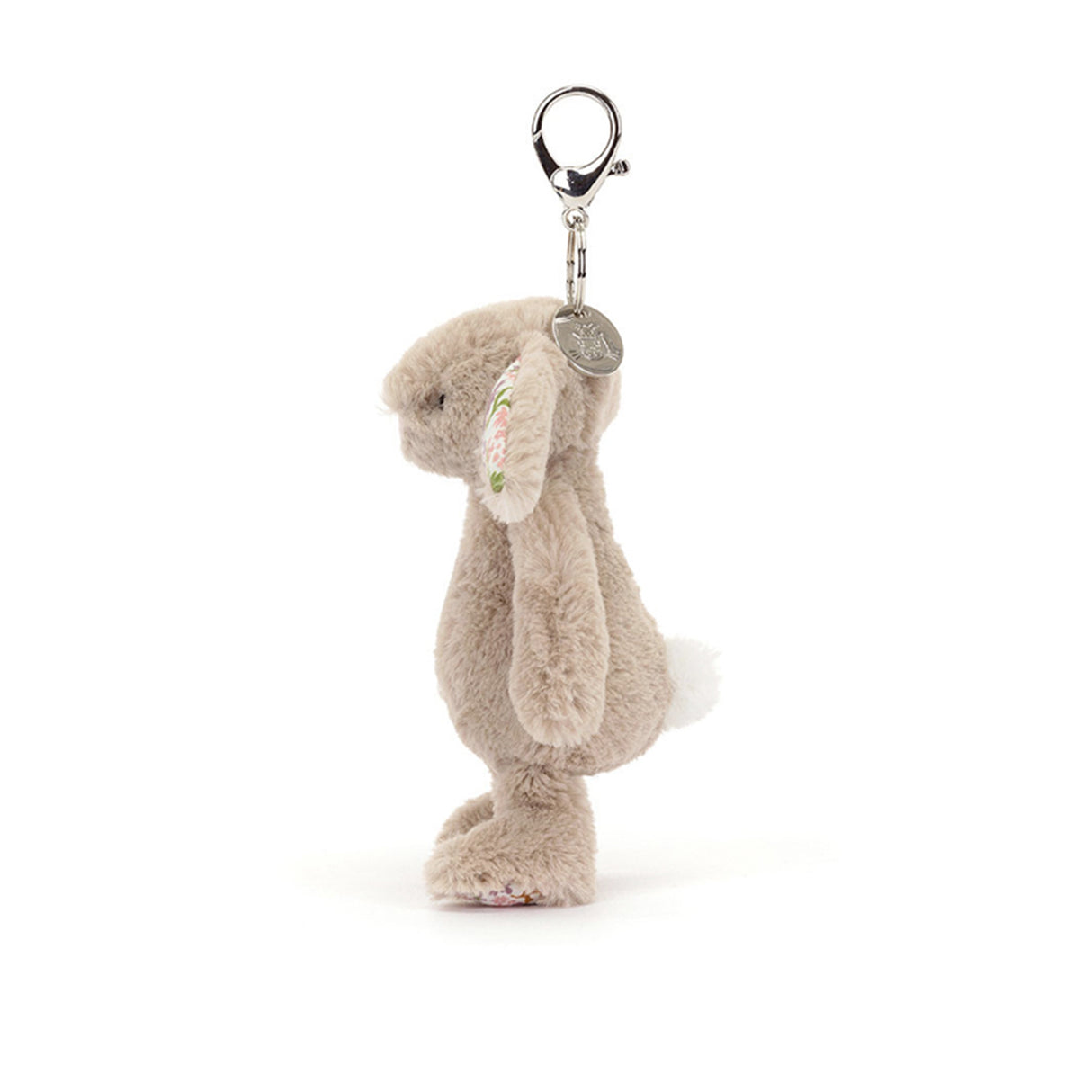 Plush bunny keychain with a tag on a white background