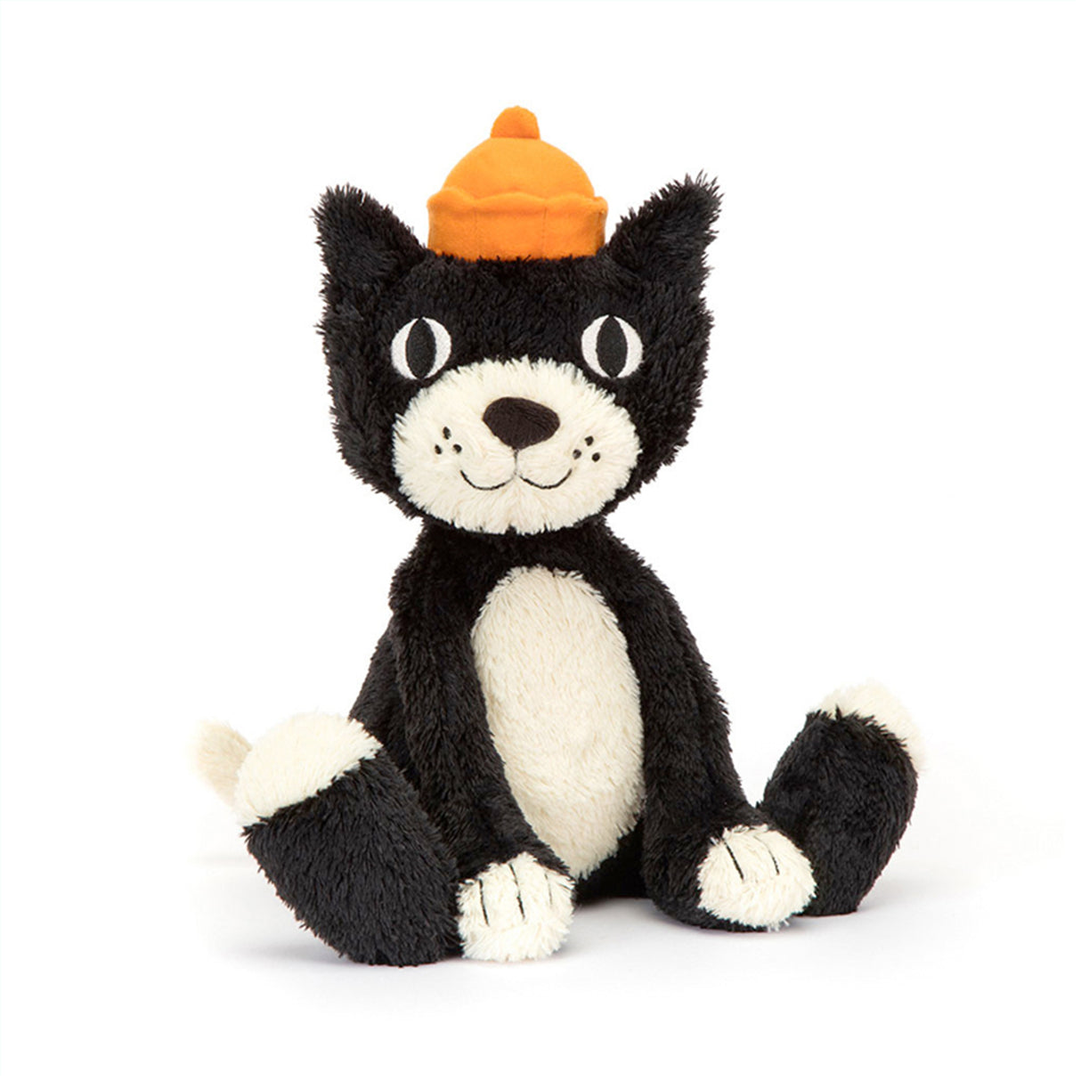 Black and white cat plush childrens toy with an orange hat on a white background