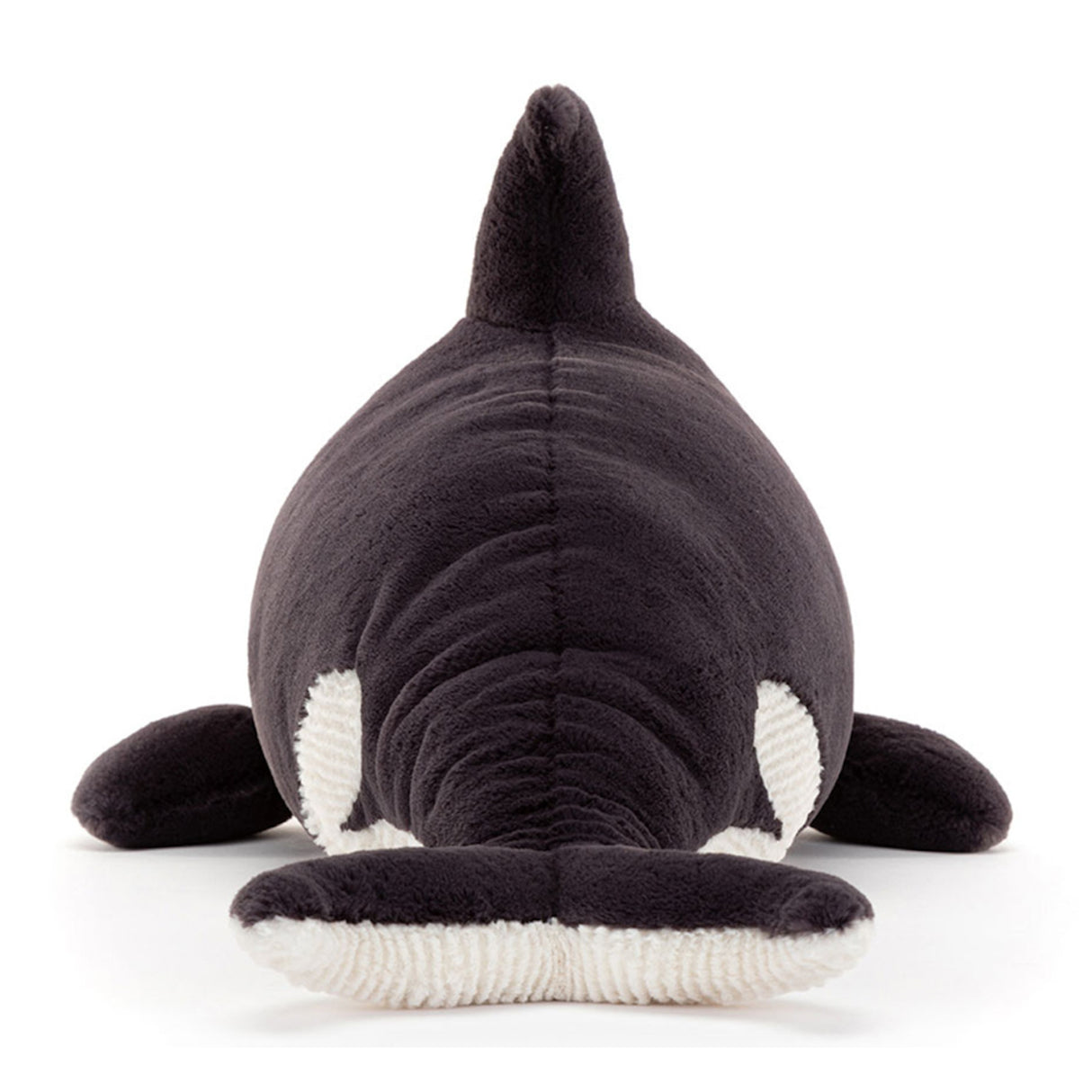 Plush toy orca whale on a white background