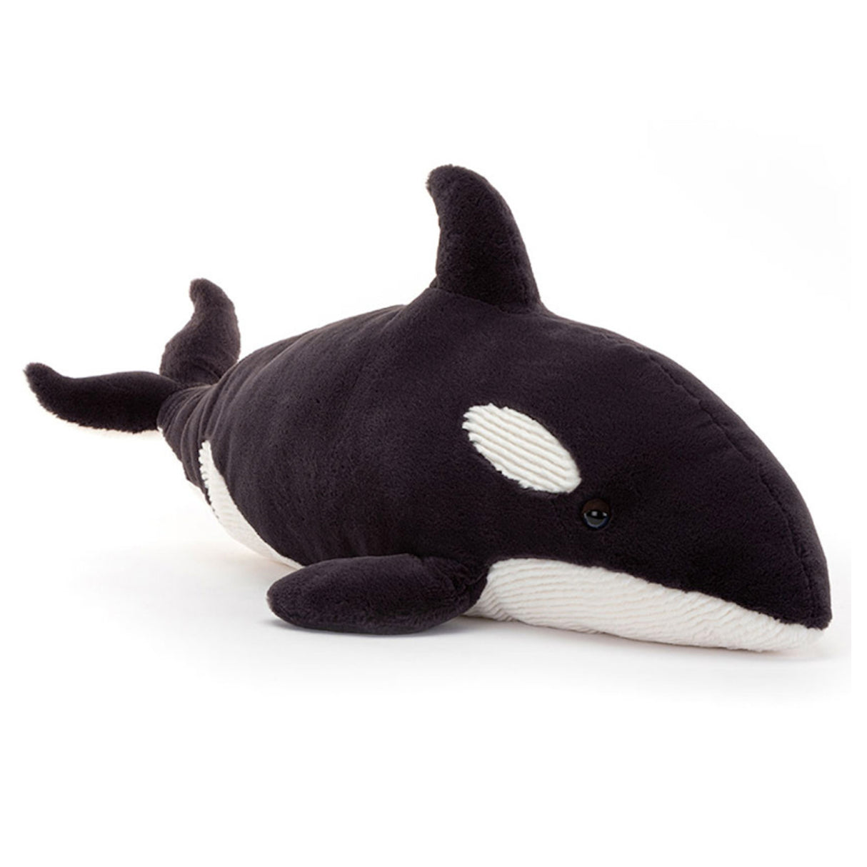 Stuffed toy orca whale on a white background