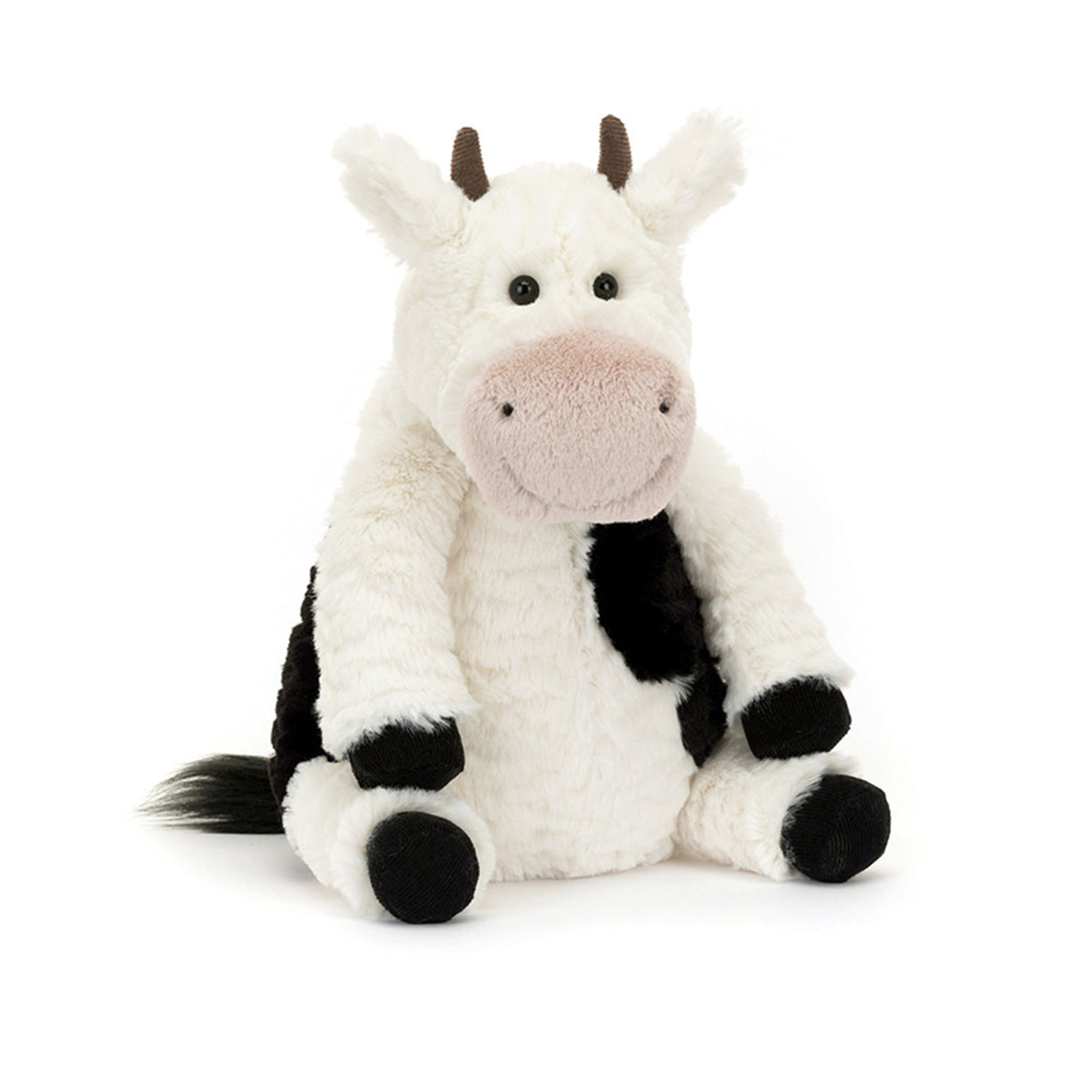 Plush jellycat soft cow toy on a white background