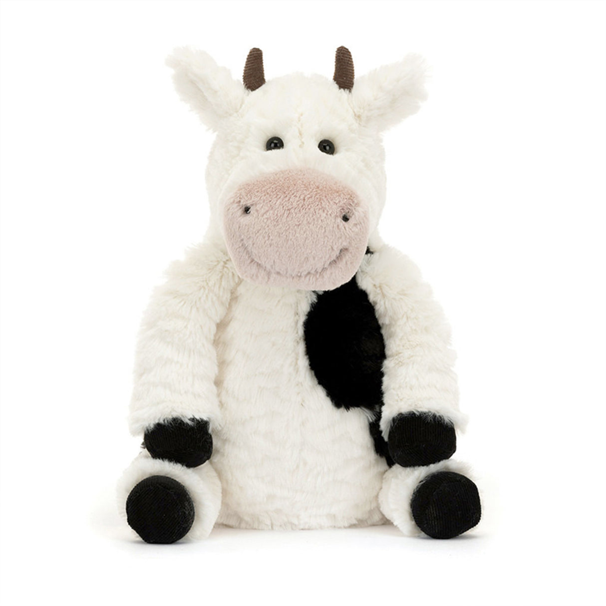 Plush cow toy with black spots on a white background