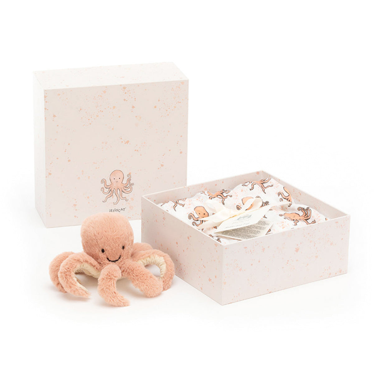Coral coloured plush octopus toy in a gift box with a muslin swaddle with octopus print