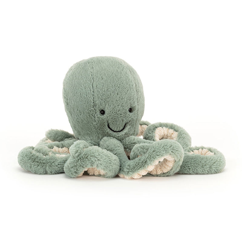 A soft toy resembling an octopus with a sage green color and cream fur beneath. It has eight tentacles and a smiling face.