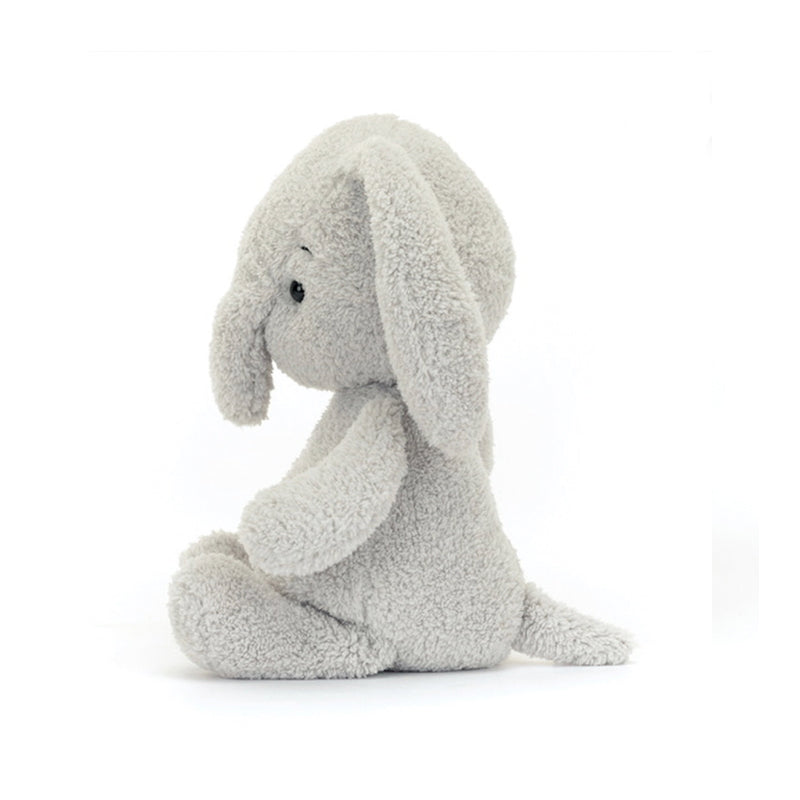 A gray plush toy resembling a baby elephant with short, floppy ears and a soft, chunky head.