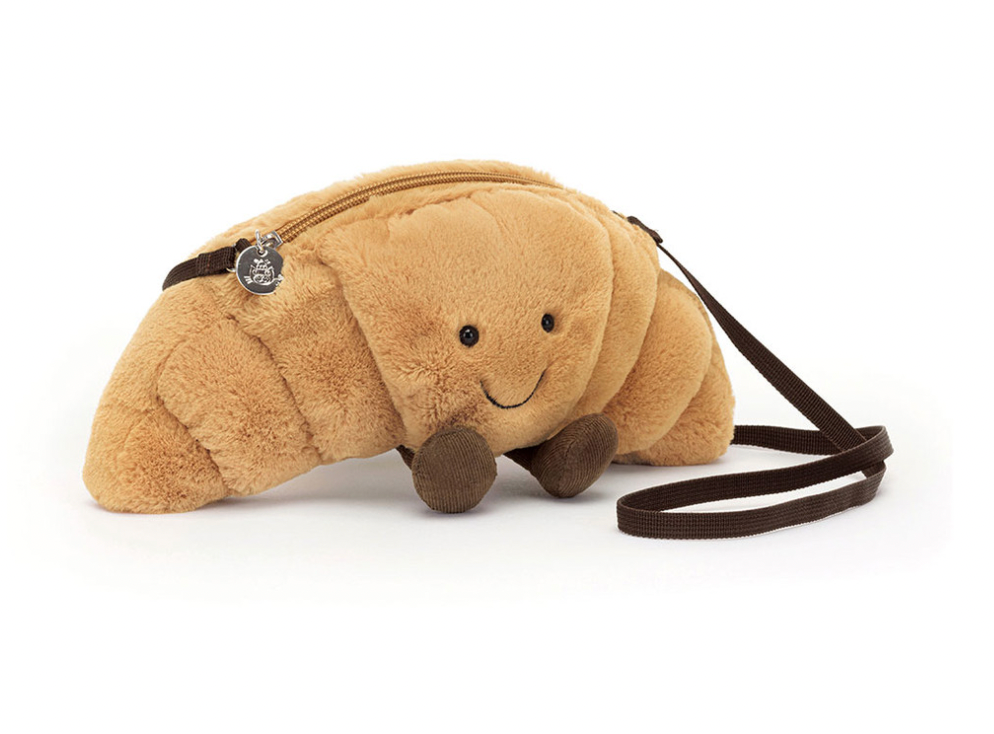 Jellycat bag shaped like a Croissant with a smiling face
