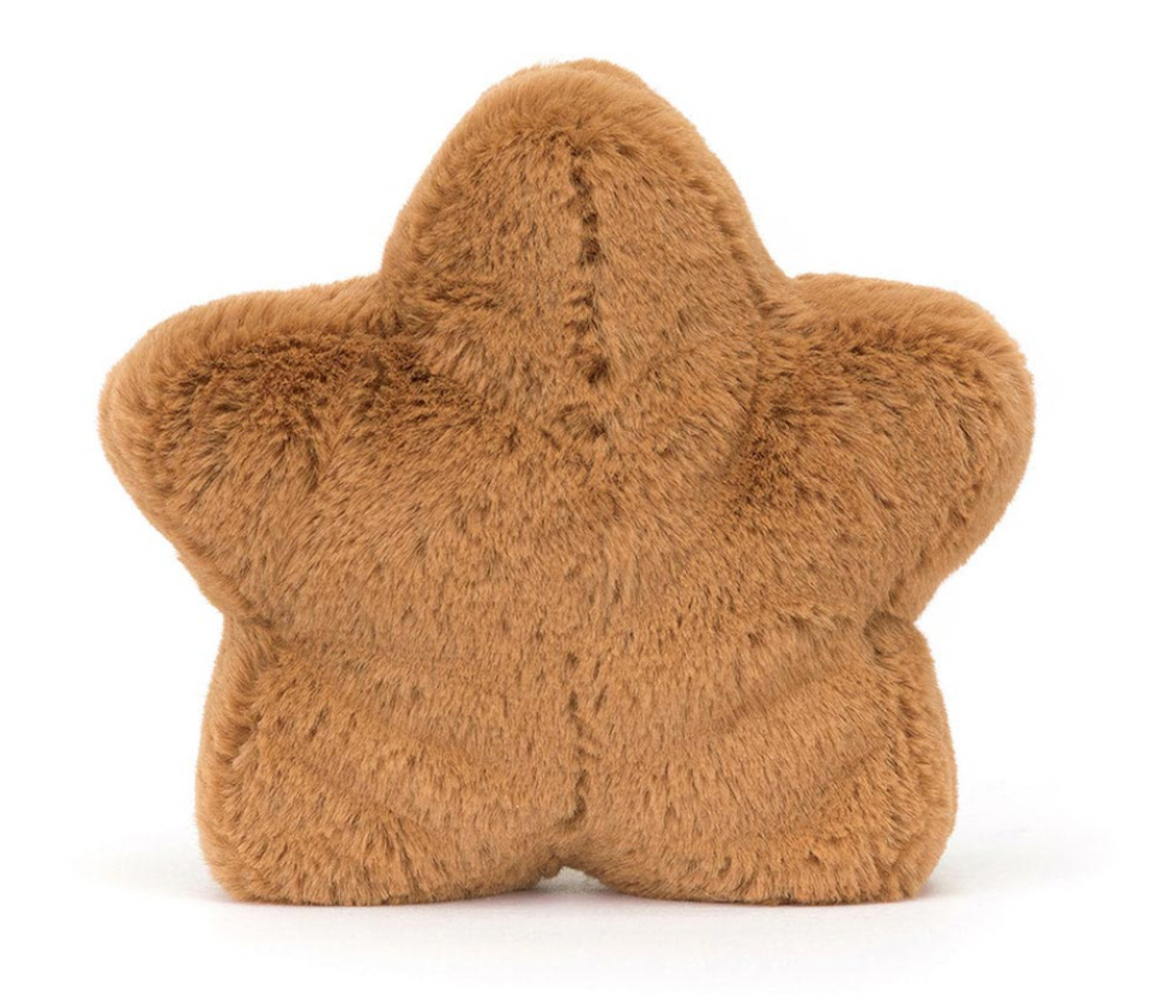 A plush toy resembling a star-shaped cookie with embroidered icing and toffee cord boots, primarily in brown color.