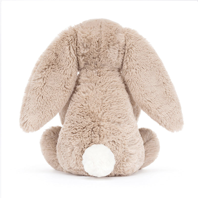 A beige plush toy rabbit sitting upright