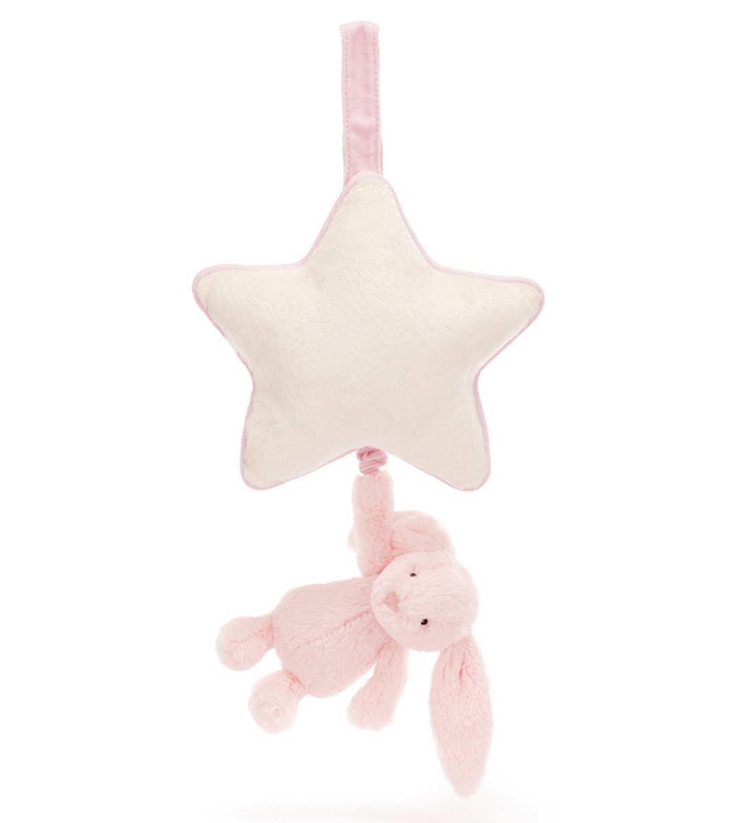 A plush toy featuring a baby pink bunny attached to a cream star-shaped musical pull.