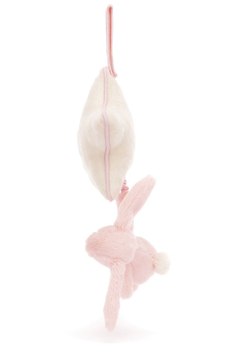 A plush toy featuring a baby pink bunny attached to a cream star-shaped musical pull.