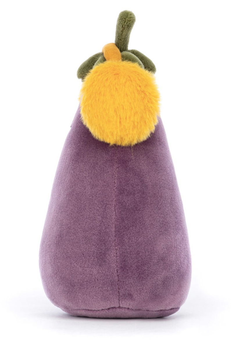 A plush toy resembling an aubergine with a smiling face, wearing yellow earmuffs, and a soft purple body.