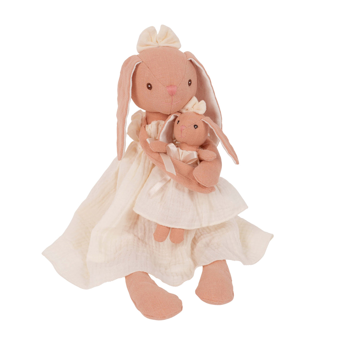 Stuffed rabbit doll with baby rabbit in arms both wearing cream dresses on a white background