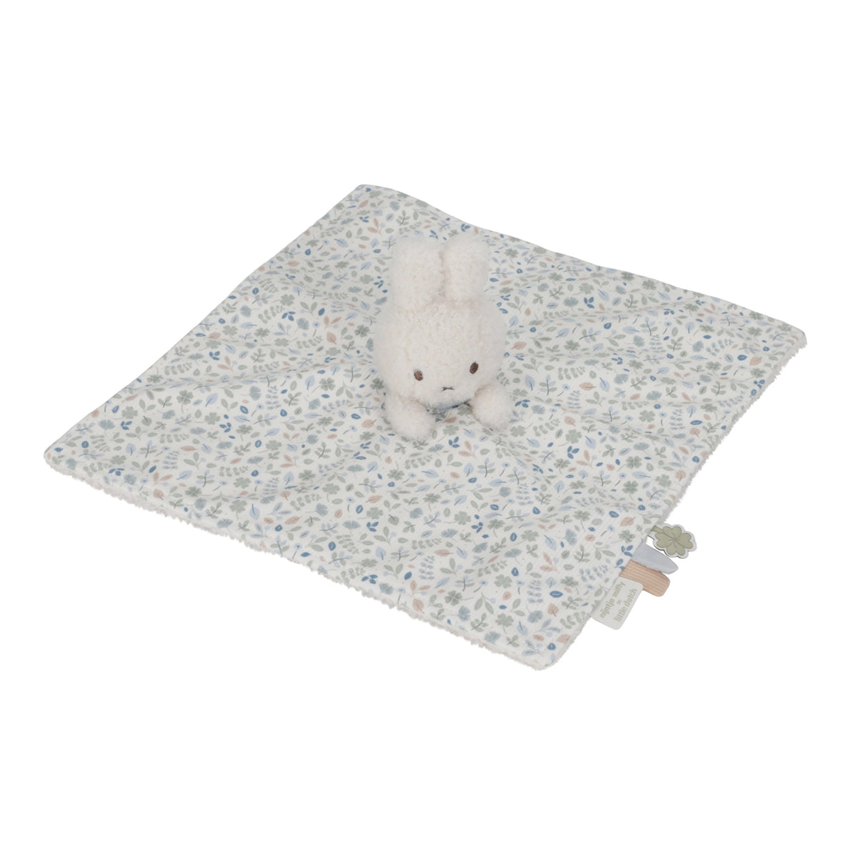 Miffy Plush toy on a floral-patterned blanket with a white background
