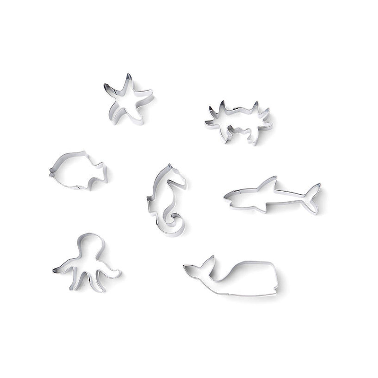 Set of silver animal-shaped ocean cookie cutters on a white background