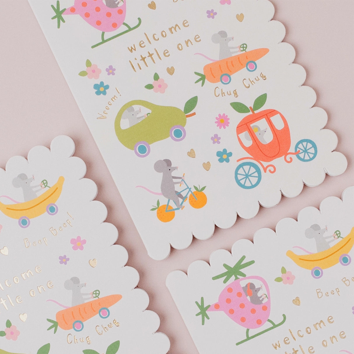 Set of baby-themed cards with illustrations and text on a pink background