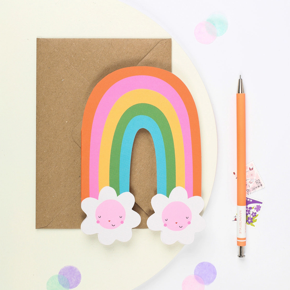 Mifkins Rainbow Blossom Birthday Card - die-cut rainbow arch with smiling flower characters and kraft envelope