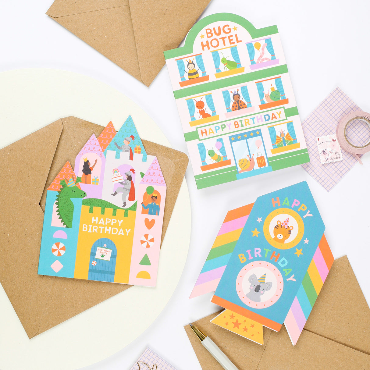 Colourful Mifkins childrens birthday cards with envelopes on a white background