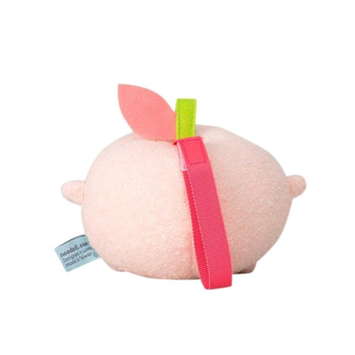 Pink soft toy resembling a peach with a green stem and dark pink band on a white background