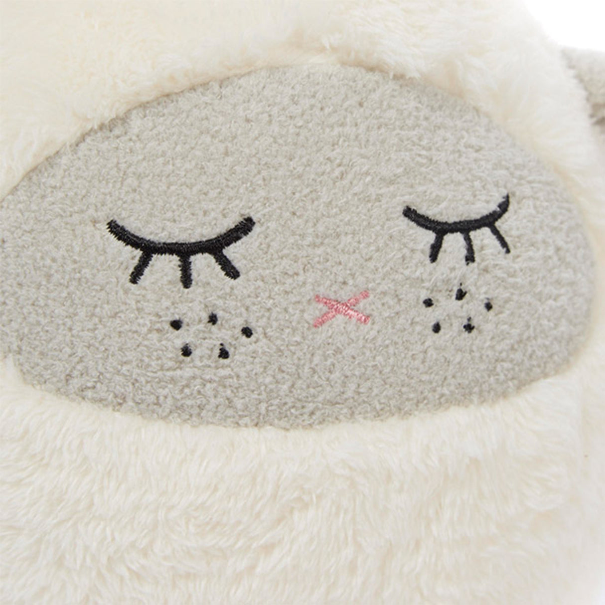 Lamb soft toy with stitched eyes, freckles and nose