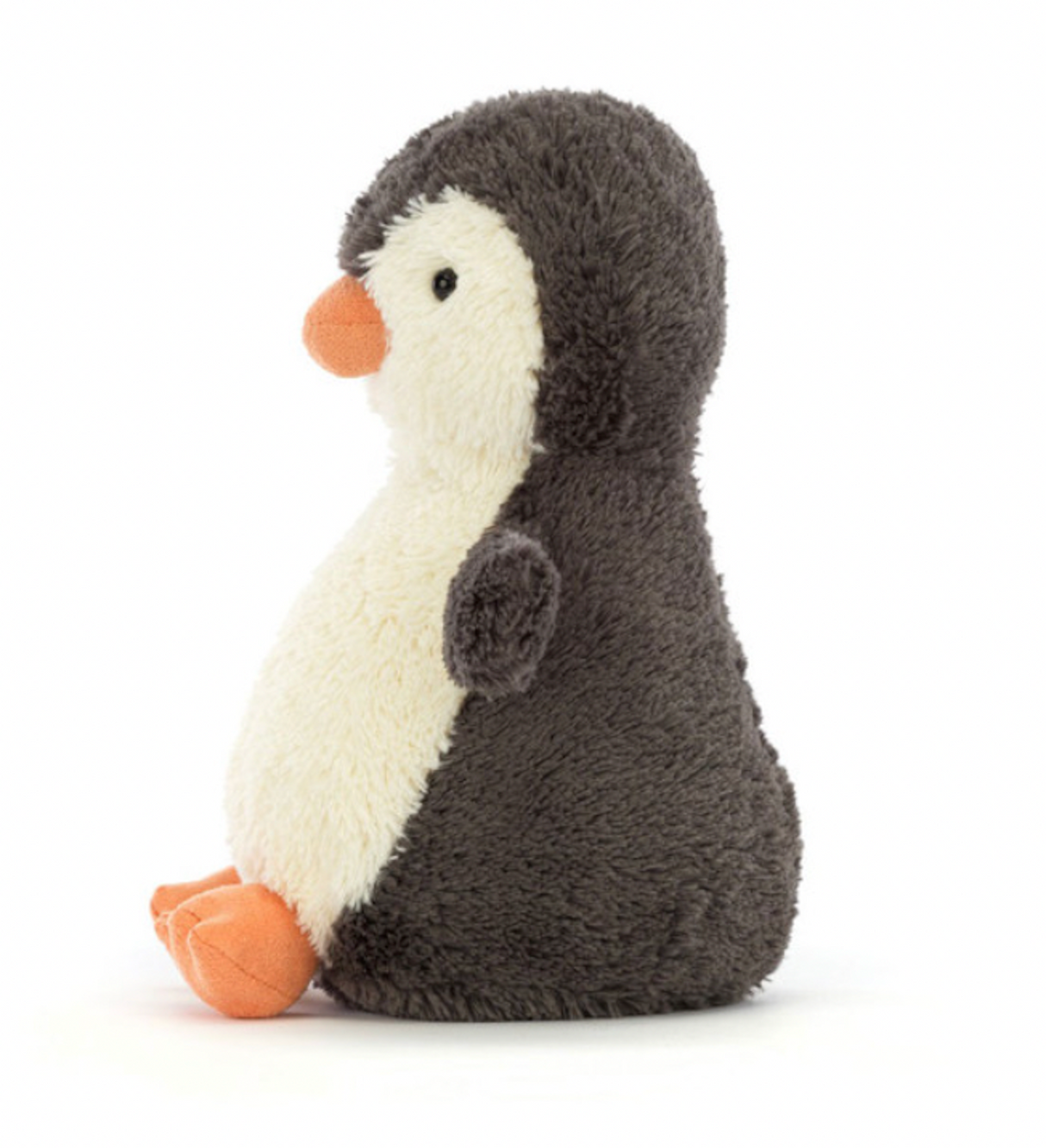 A small plush toy resembling a peanut-shaped penguin with soft grey and white fur, featuring a friendly face and flippers.