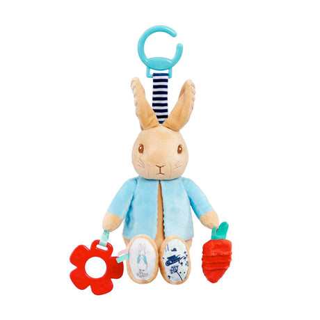 Plush Peter Rabbit baby toy with baby teether and carrot on a white background