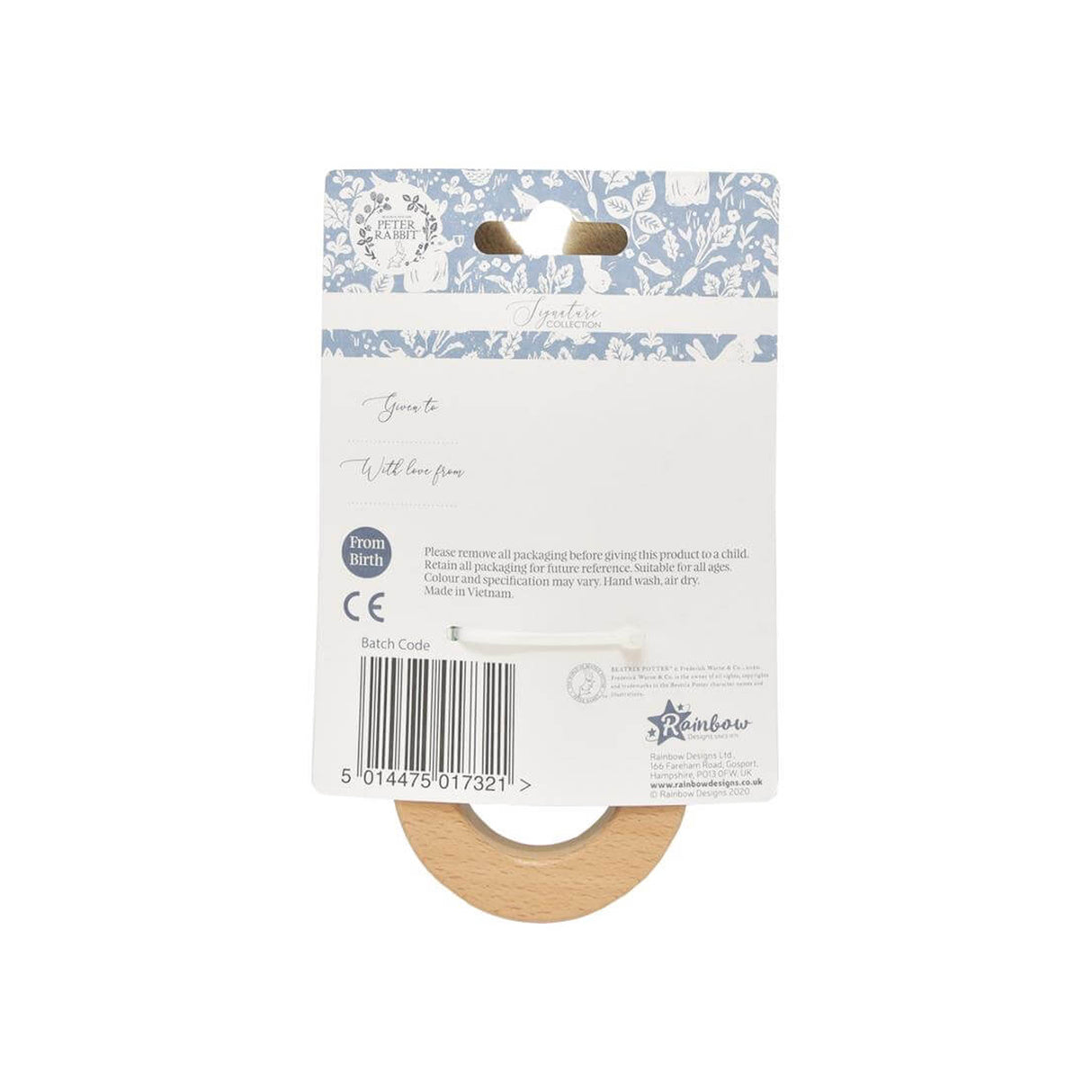 Wooden ring on a floral patterned card with branding and product details.