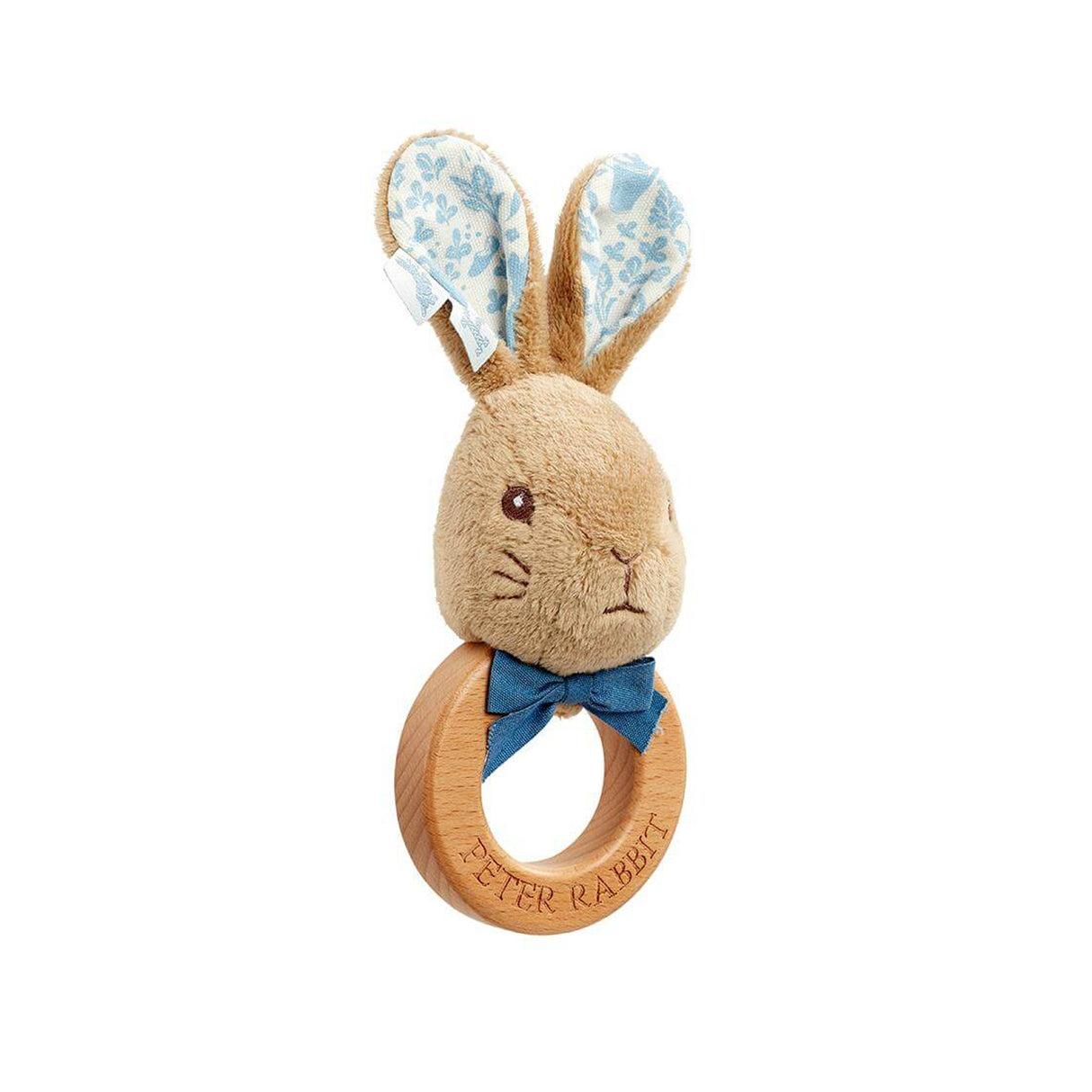 Plush rabbit toy with wooden ring and floral ears on a white background
