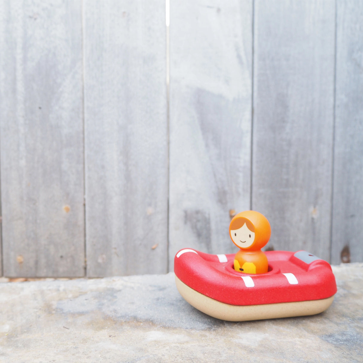 Toy lifeboat with a figure