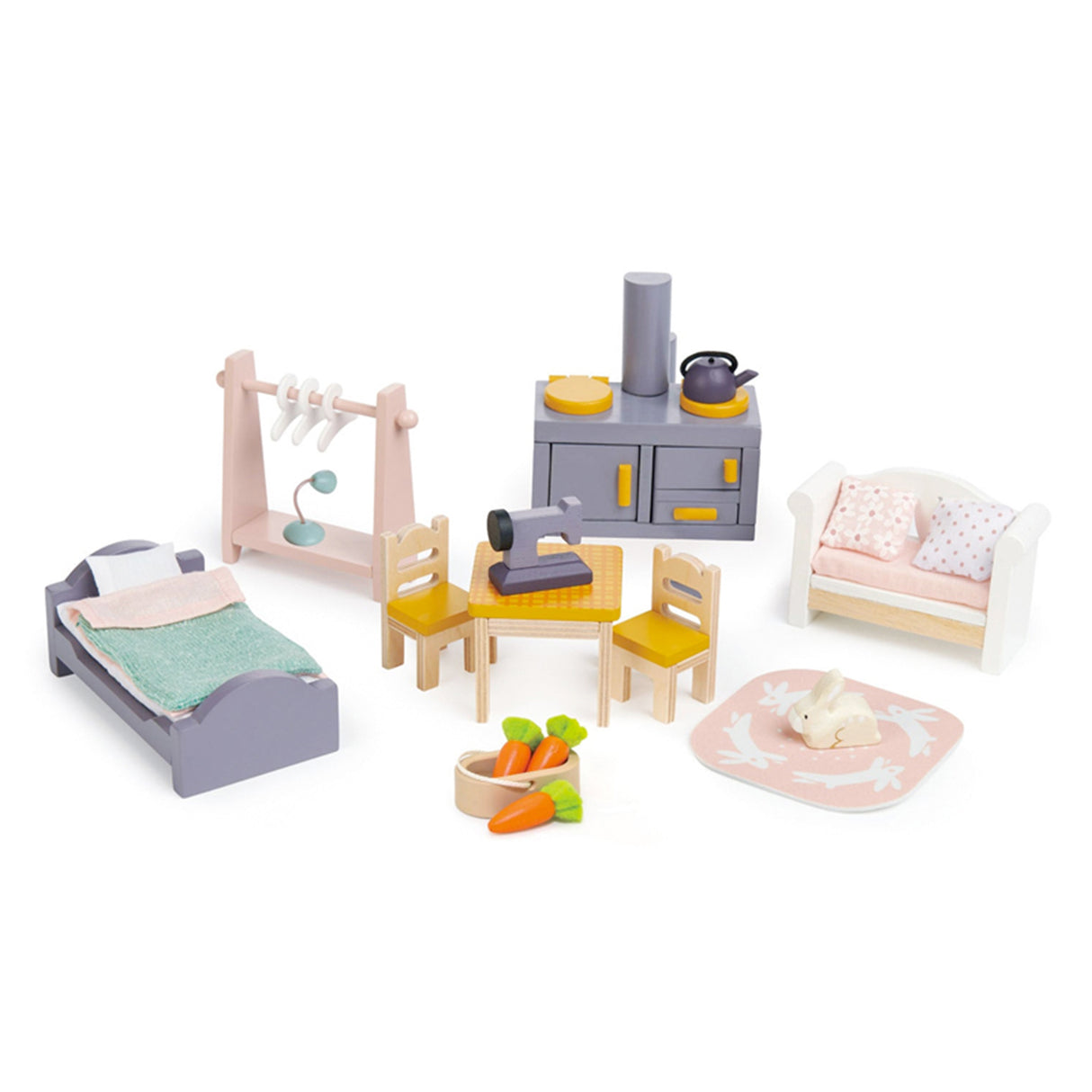 Set of toy wooden furniture including a bed, dining table, and chairs on a white background