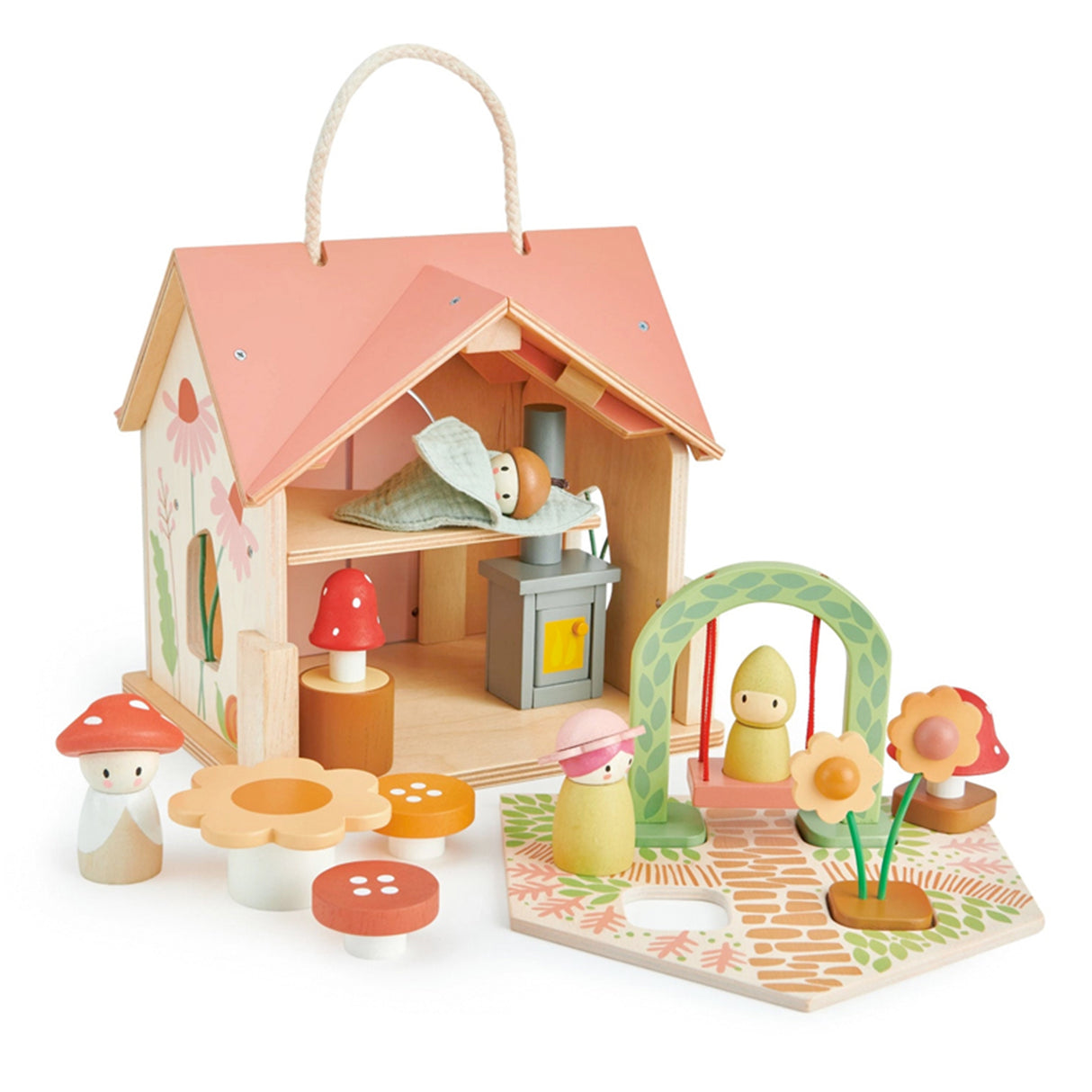 Wooden toy house with colorful characters, mushroom table and swing on a light surface