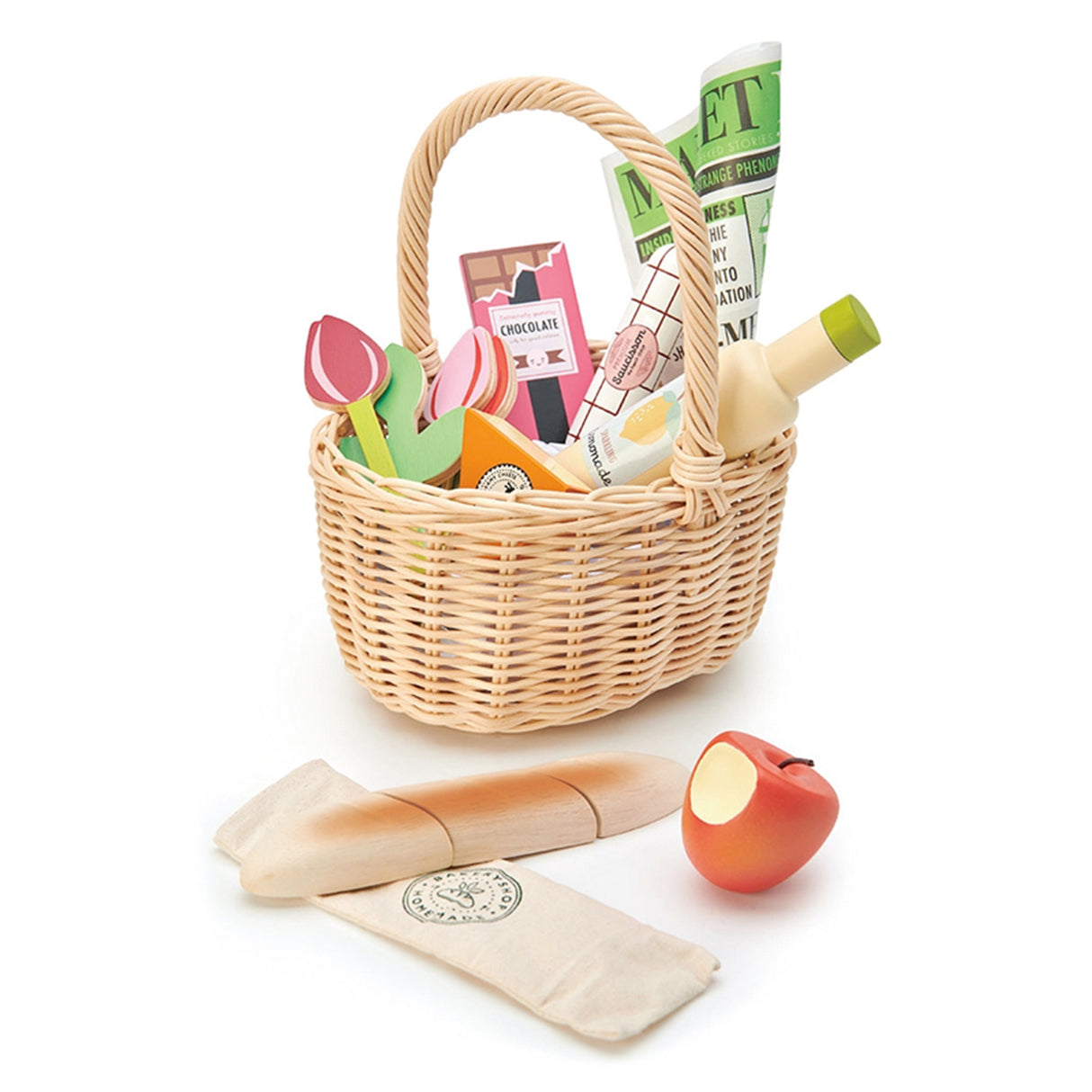 Wicker picnic basket with food items on a white background
