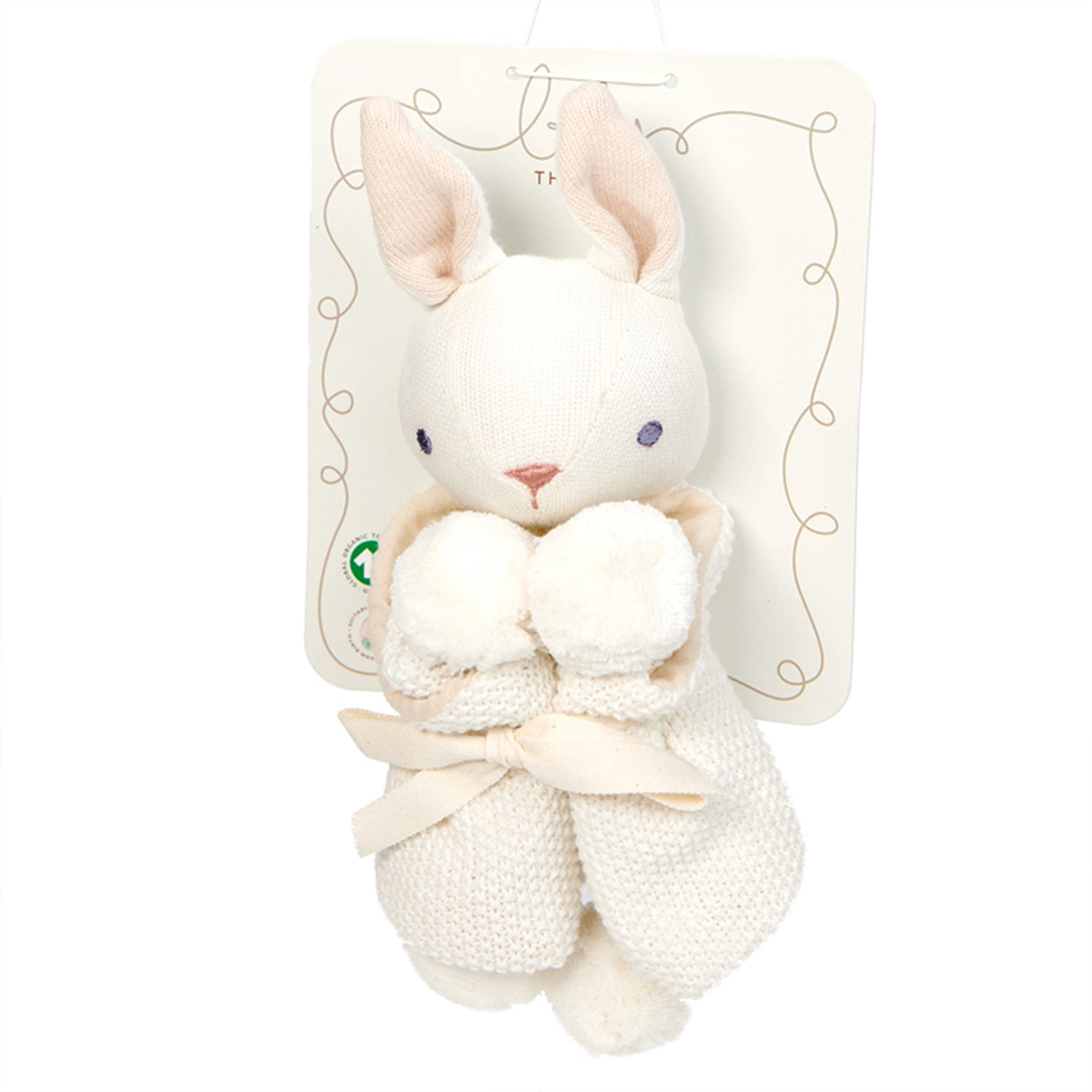 White plush rabbit toy with pom-poms on a white background