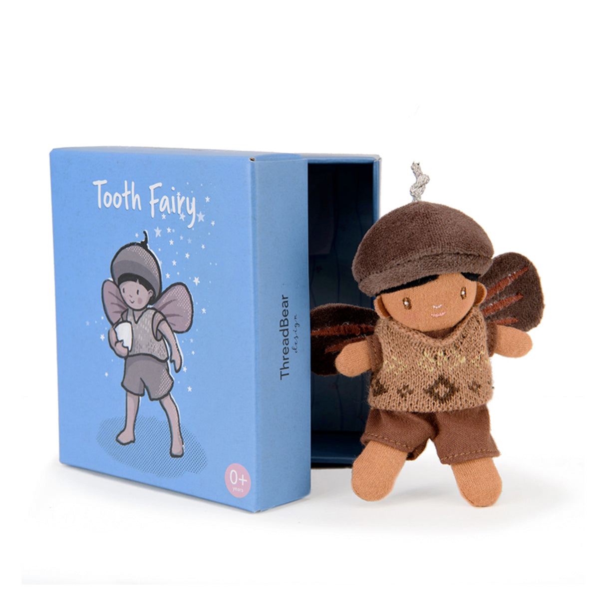 A soft brown toy resembling a tooth fairy character, with a blue box packaging that also features a picture of the toy.