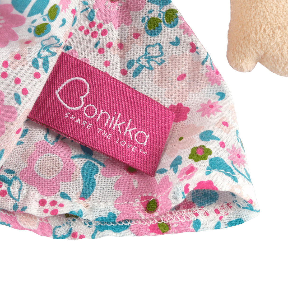 Pink label on a floral dress with the brand Bonikka