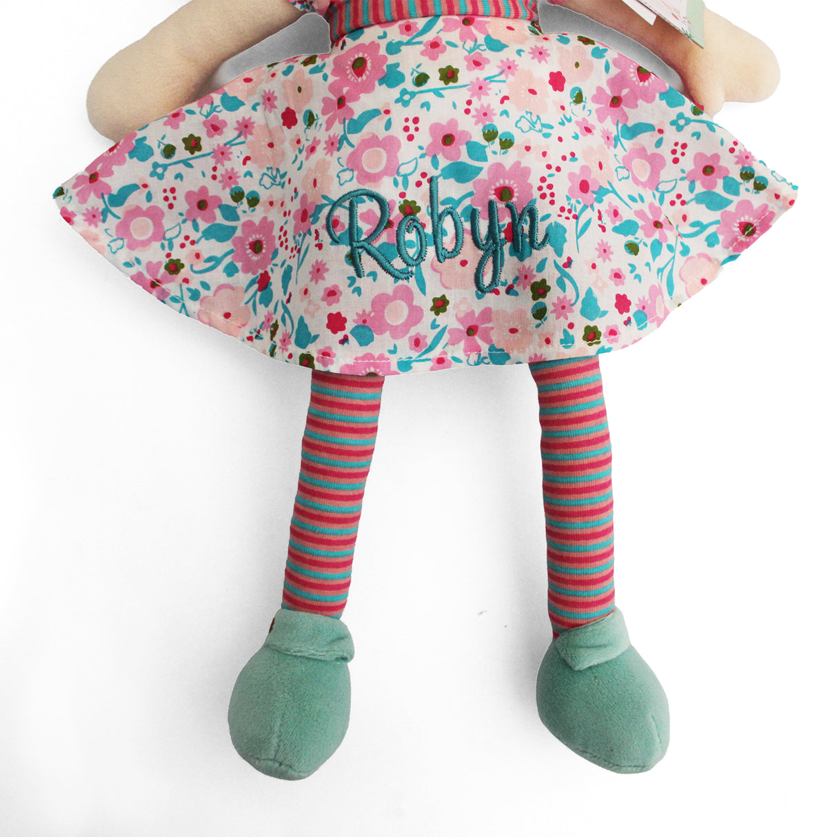 Personalised rag doll toy wearing a pink and turquoise dress, stripey tights and turquoise shoes.