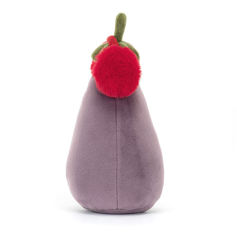 A plush toy resembling an aubergine with a smiling face, wearing fluffy red earmuffs with a green leaf on top, on a white background.
