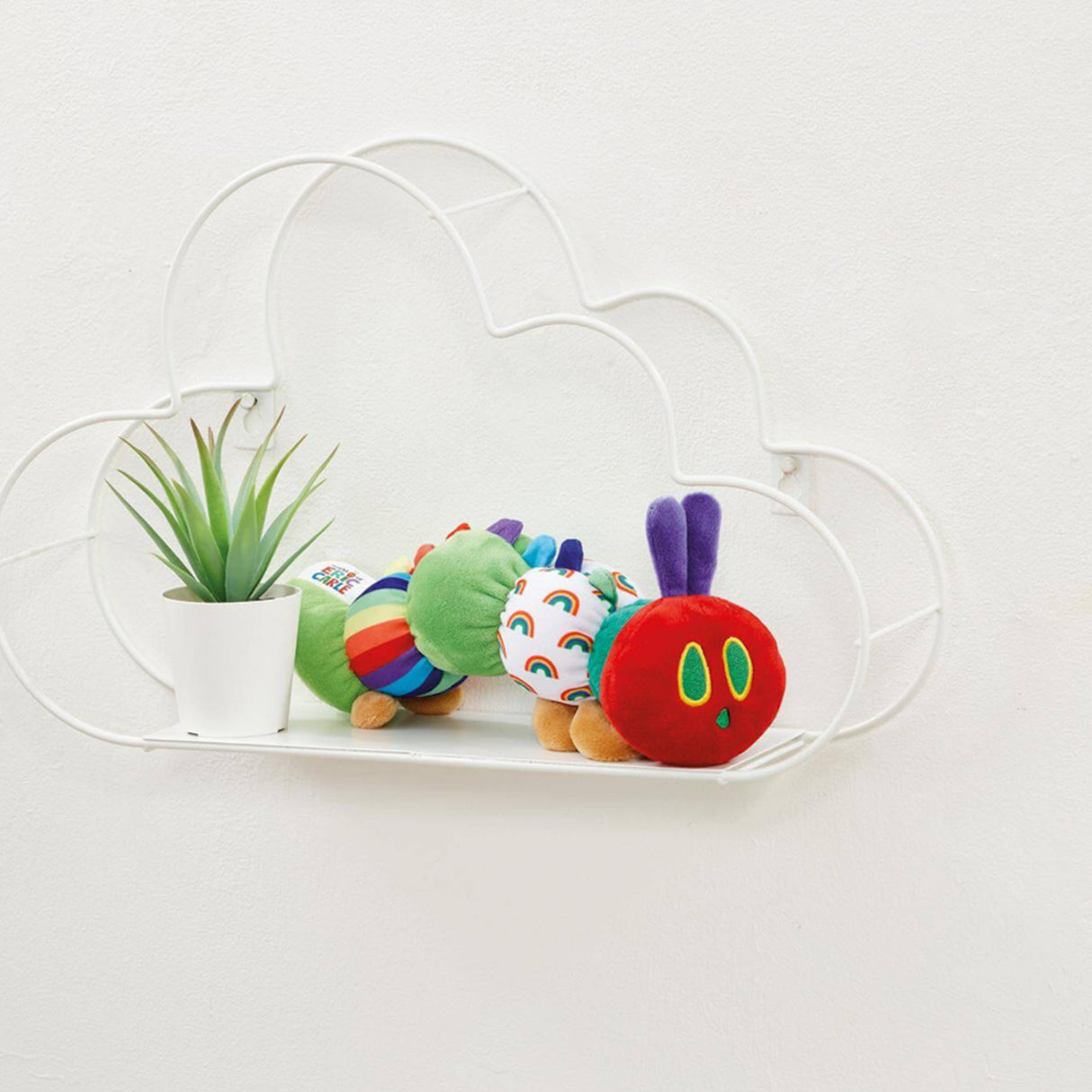 Plush toy hungry caterpillar on a shelf